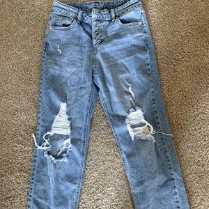 Distressed denim jeans
